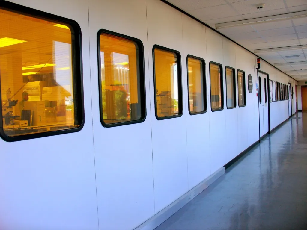 Cleanroom corridor with observation windows in a manufacturing facility