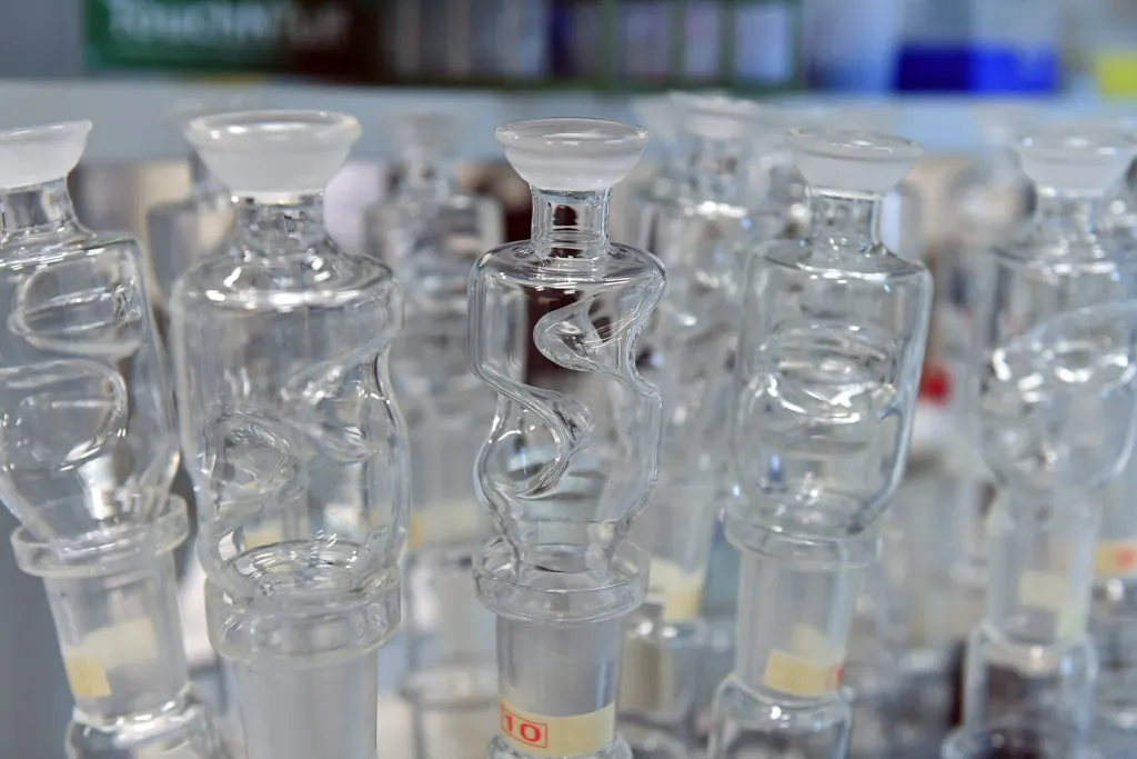 Rows of clean glass sample bottles in a laboratory